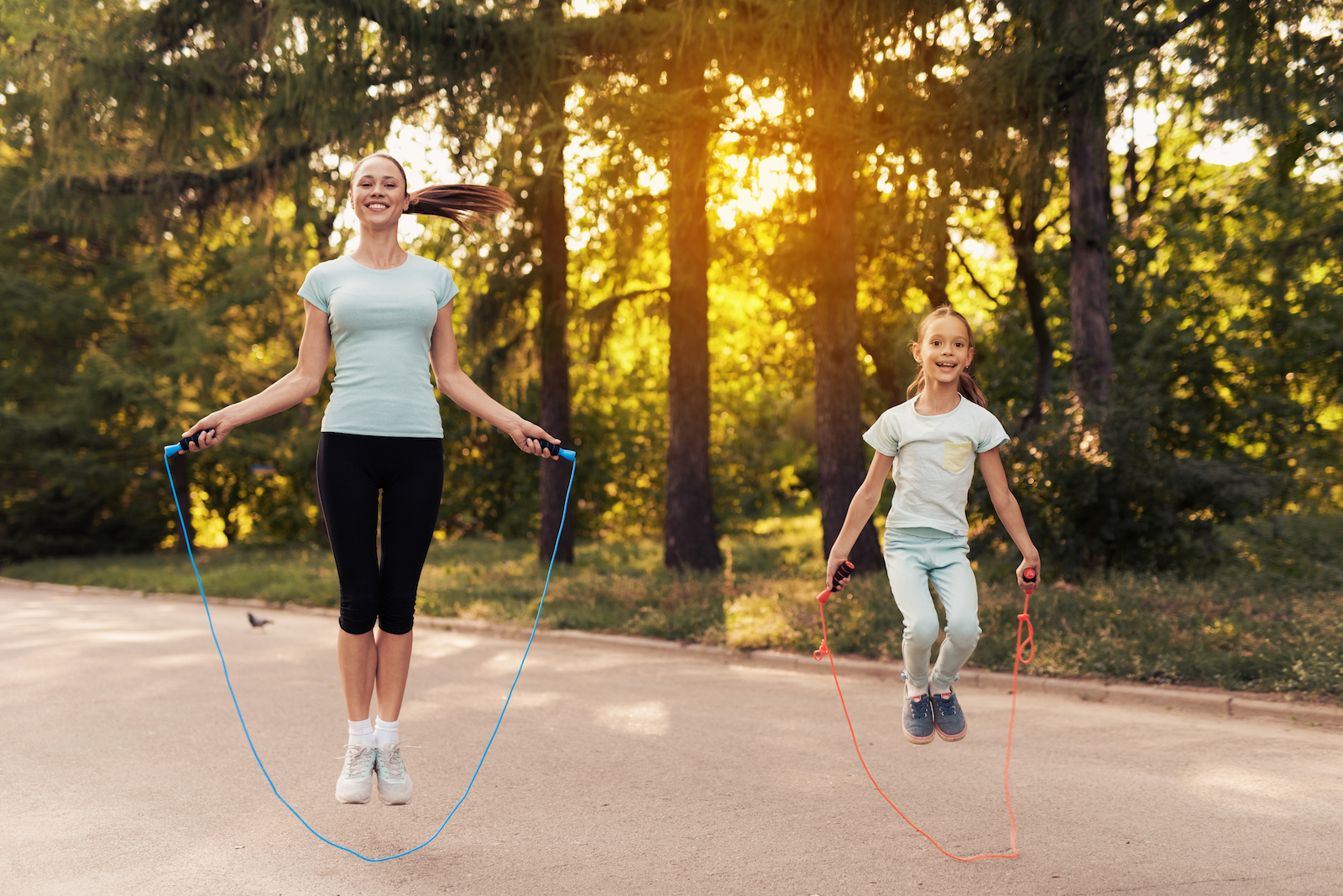 A mother and daughter enjoying jumping rope for cardio